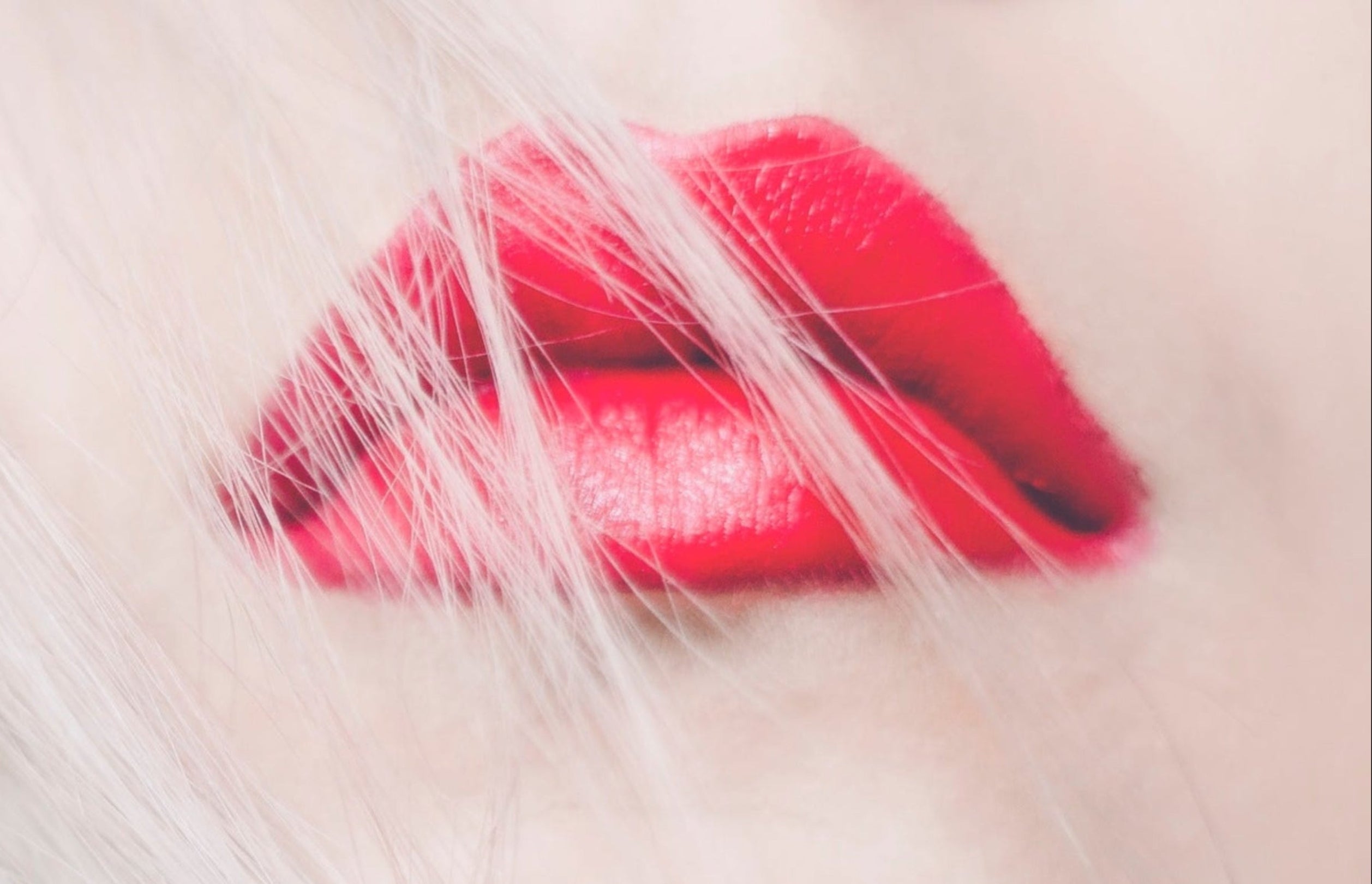 Close-up of red lipstick on a blurred background